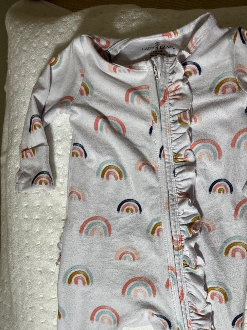 Caden Lane footed zippered sleeper with ruffles on zipper and bum